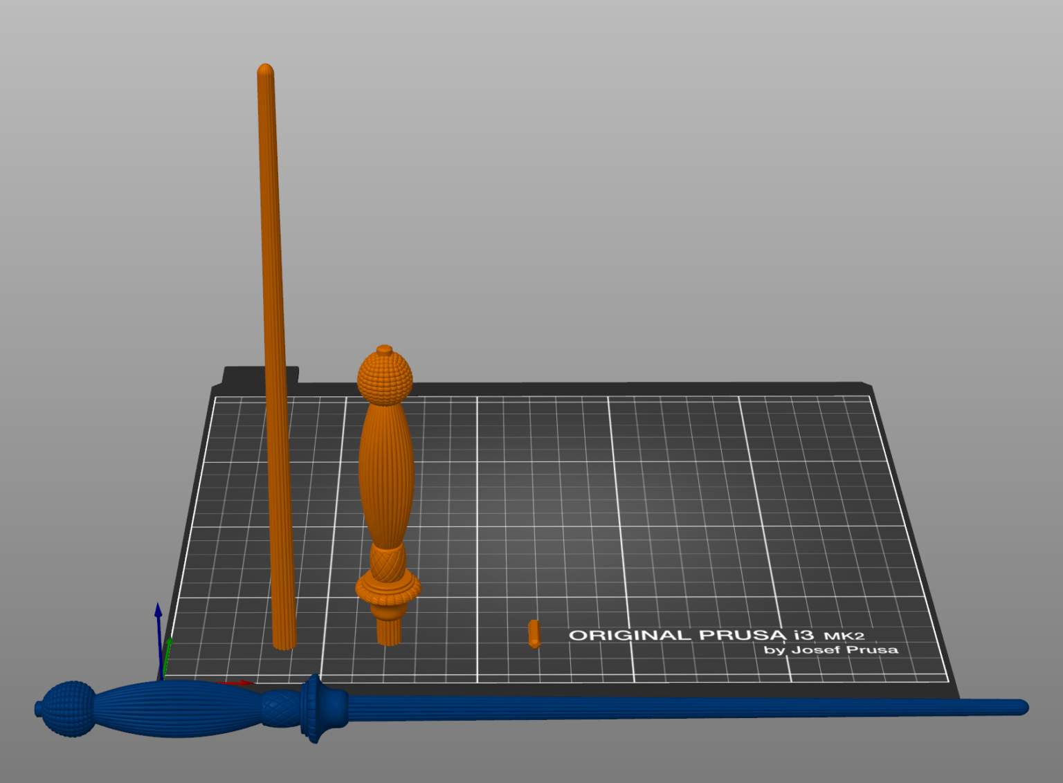 Slicer screenshot of Gormlaith Gaunt’s Wand STL, orange wand and blue base on Prusa print bed.