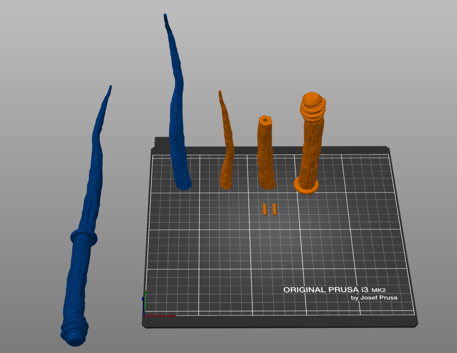 Slicer screenshot of Robyn Thistlethwaite Wand STL, blue and orange wand parts on Prusa print bed.