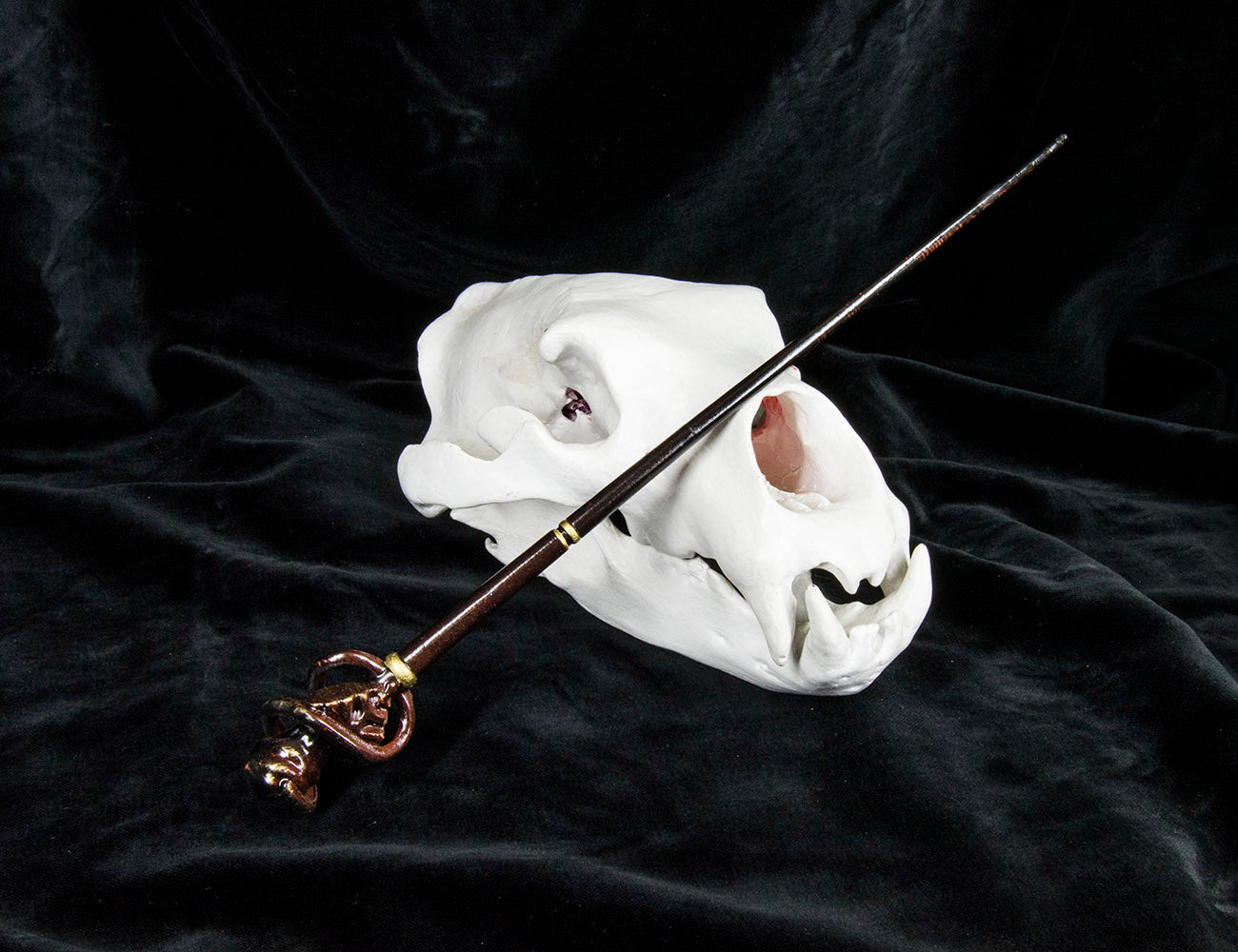 Painted 3D render of Death Eater Dark Mark Wand, black wand with skull-shaped handle, 3D printed cosplay prop.