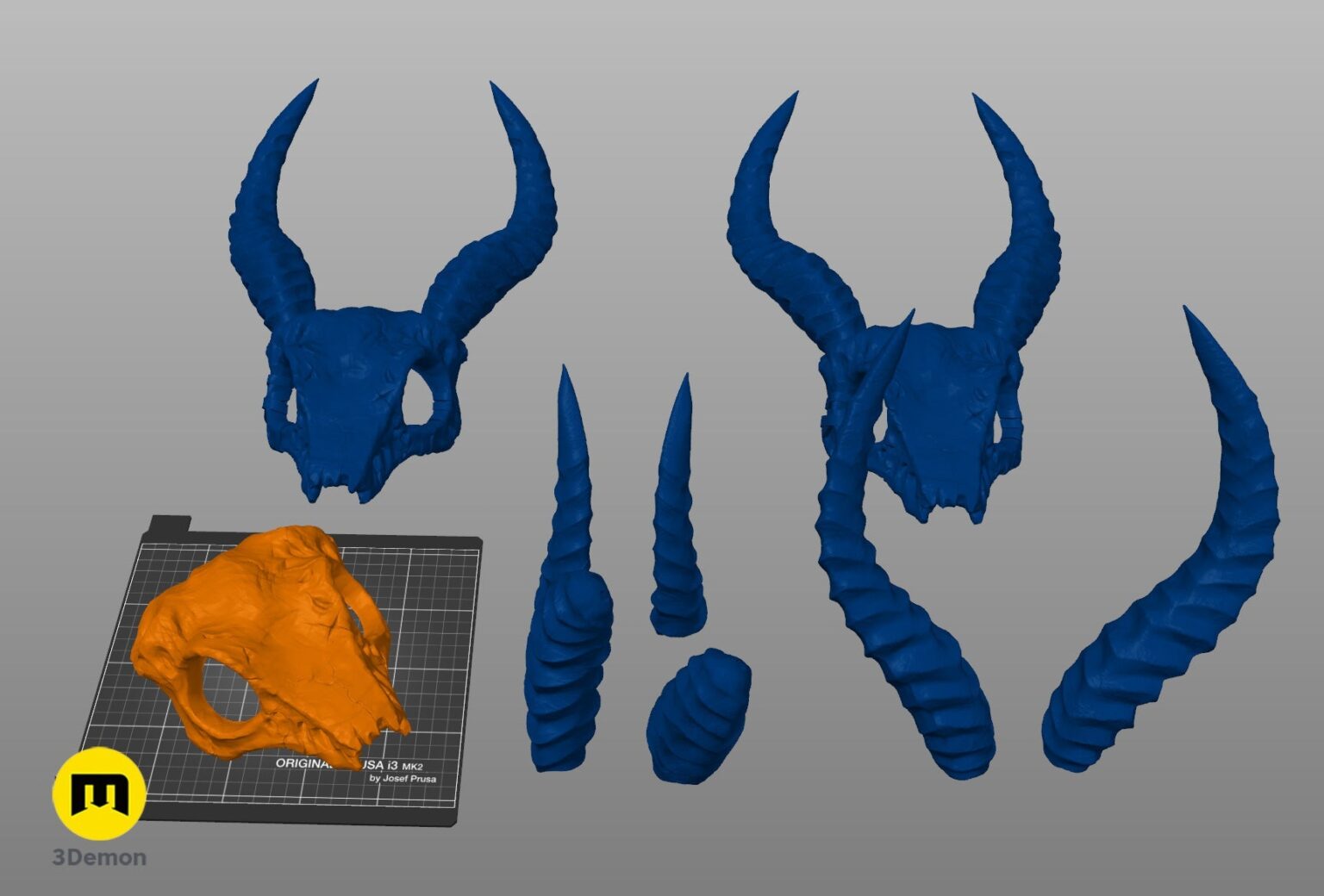 Disassembled parts of Shaman Skull with Horns 3D print, five blue curved horn segments and skull base.