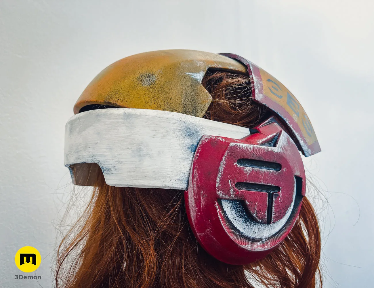 Painted 3D render of Sabine Speeder Helmet - Ahsoka, red and gold 3D printed cosplay prop.