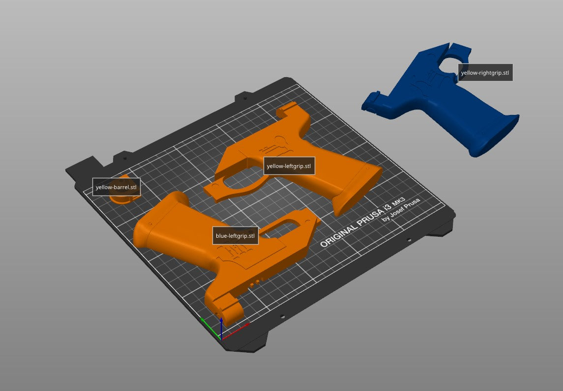 Slicer screenshot of Westar-35 Sabine Wren blasters STL, orange/blue parts on Prusa print bed.