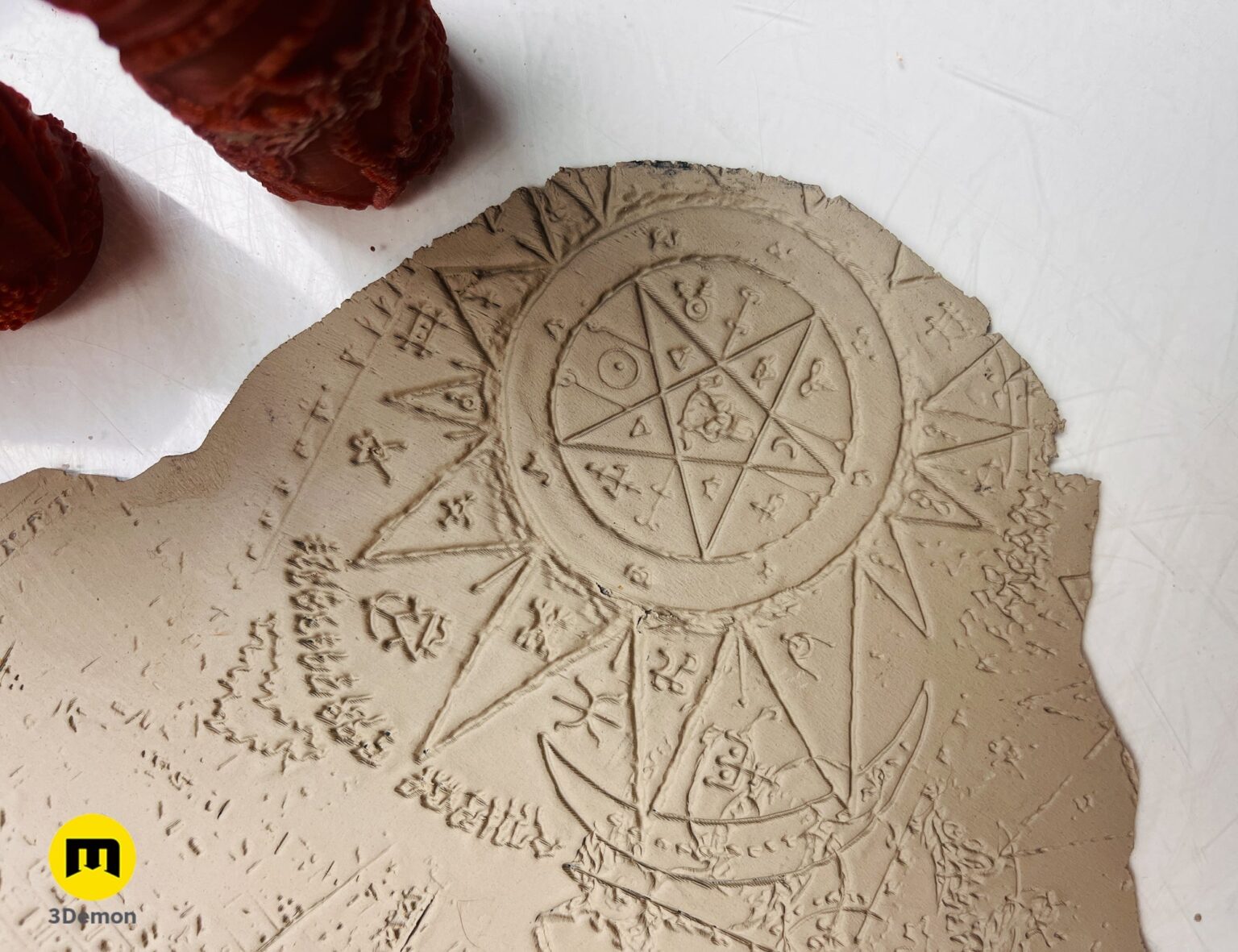 Close-up of DnD terrain rollers - Symbols, intricately carved 12-segment circular 3D printed terrain piece.