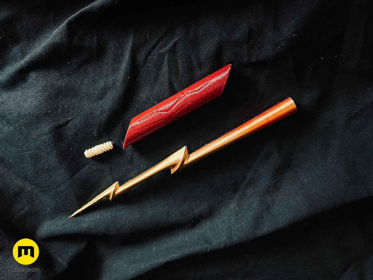 3D printed parts of the Flash magic wand including a red handle, golden lightning shaft, and connector cosplay prop.