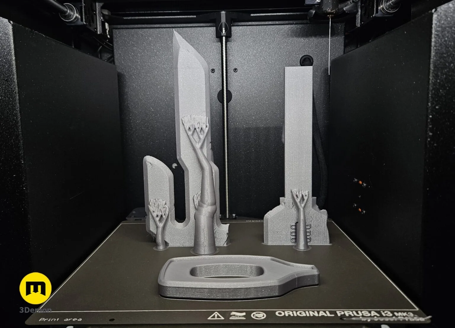 Slicer screenshot of Inverted Spear of Heaven STL, grey 3D print with 3-pronged blade on Prusa bed
