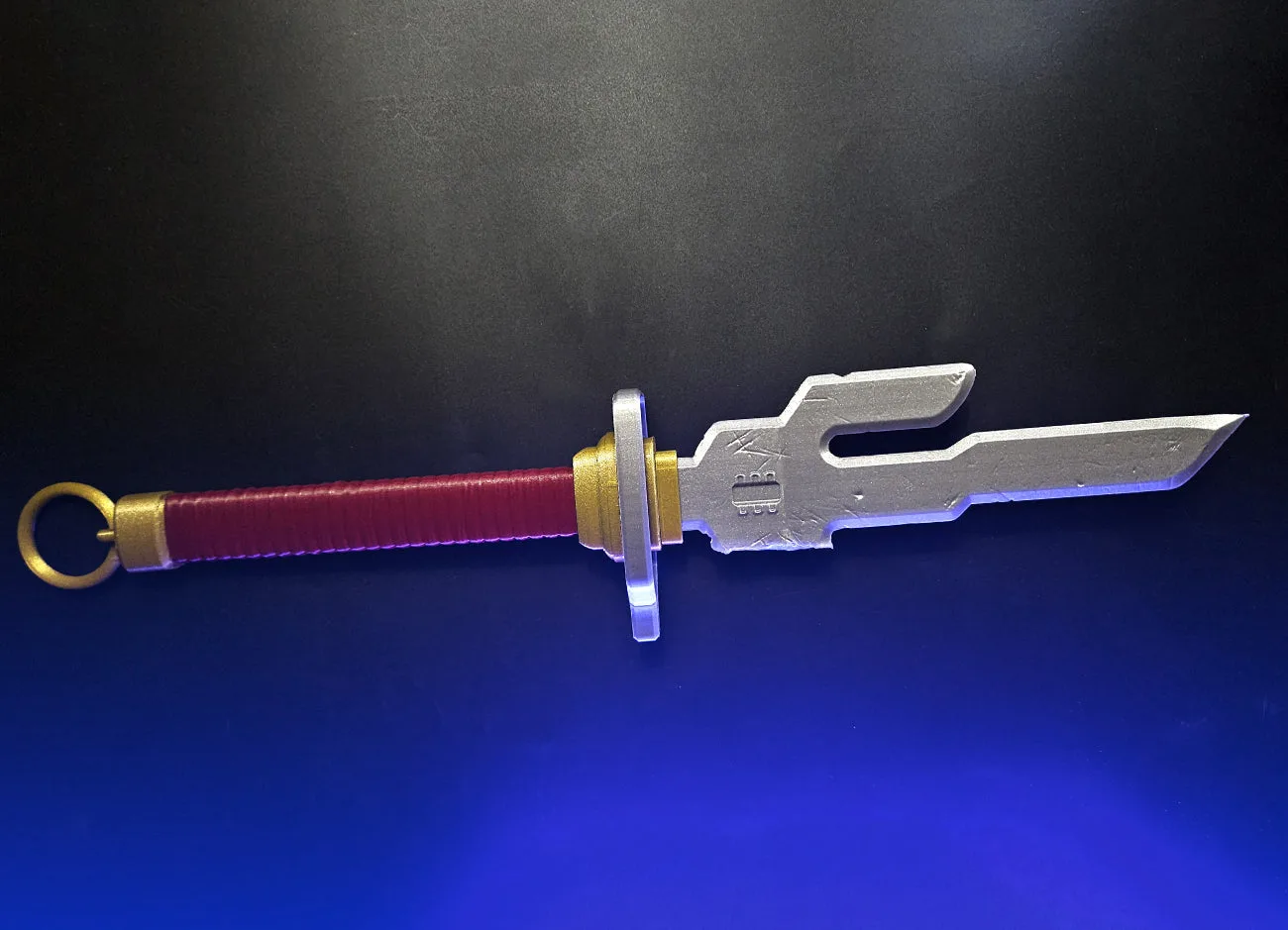 Painted 3D render of Inverted Spear of Heaven - Jujutsu Kaisen STL, red grip, dual-bladed.