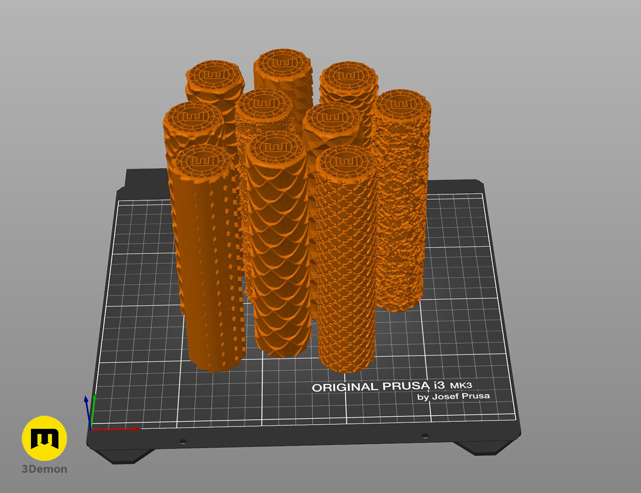 3D slicer software view of multiple orange scale and armor terrain roller STL models on a virtual print bed.
