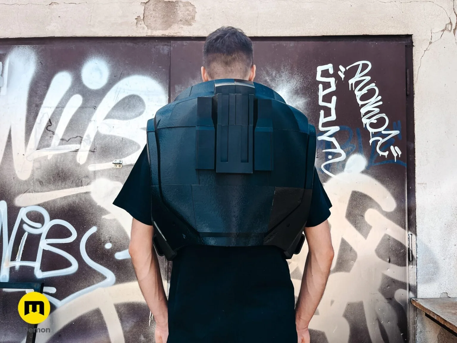 Close-up of the back of a person wearing black 3D printed Space Marine armor showing the collar and upper back.