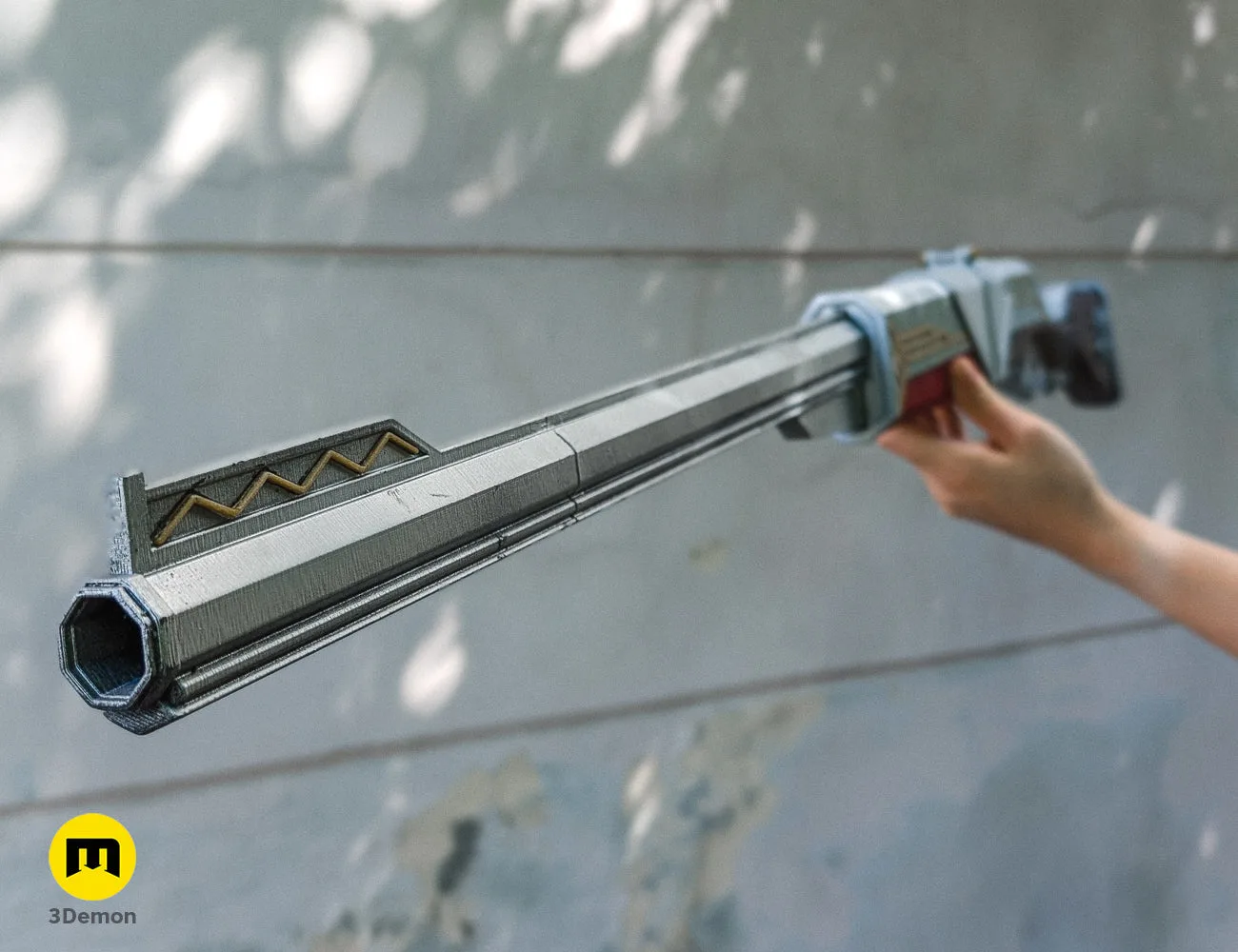 Side photo of the finished Caitlyn sniper rifle prop, demonstrating the scale and fine 3D printed details of the barrel.