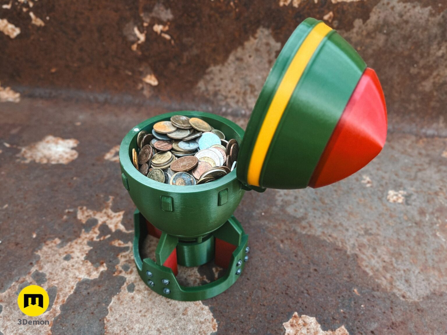 Close-up of a 3D printed Fallout Mini Nuke bomb being held, showing the top hatch open and textured surface.
