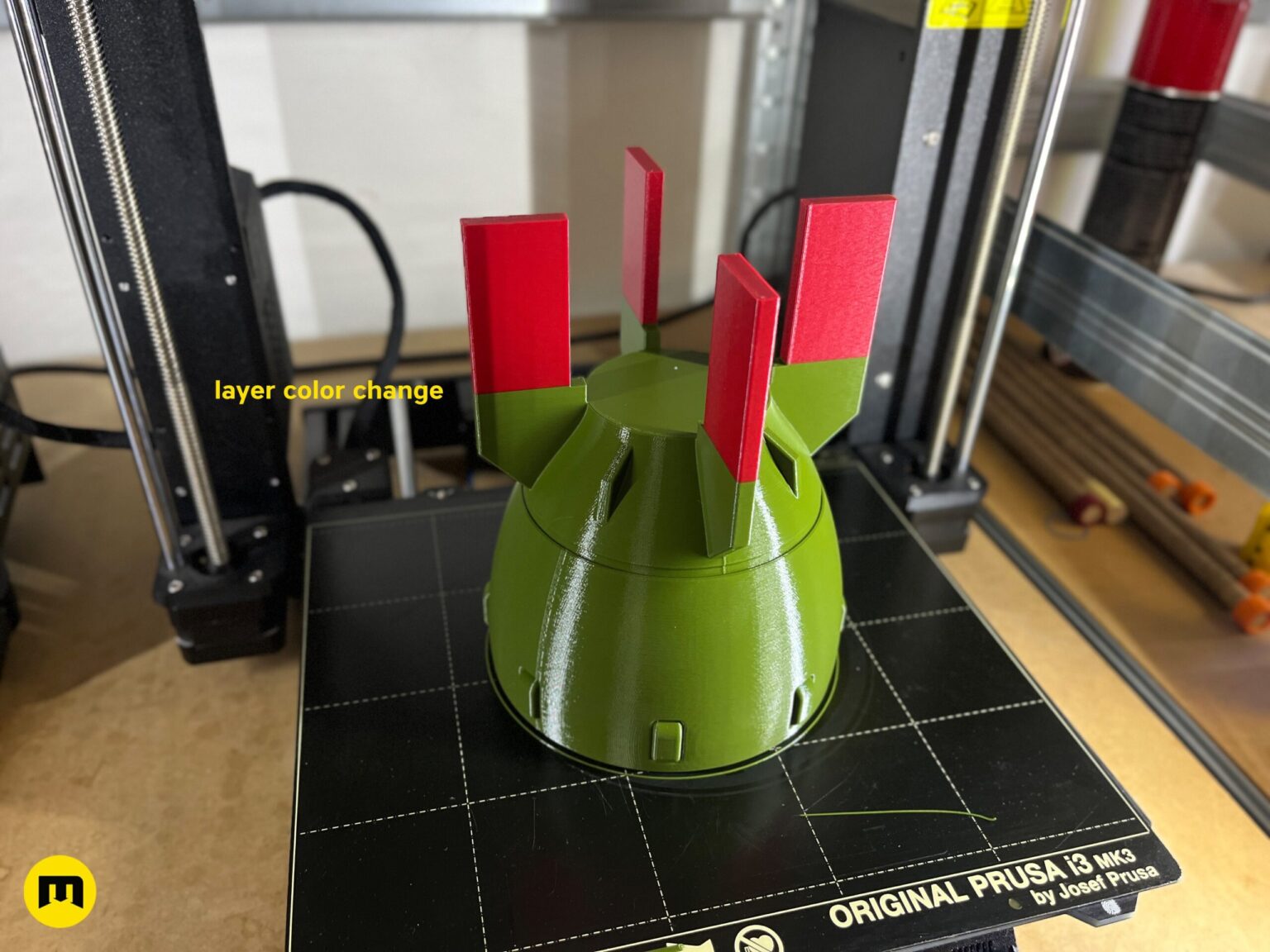 Hand holding a 3D printed Fallout Mini Nuke bomb replica, showing the scale and the top hatch details.