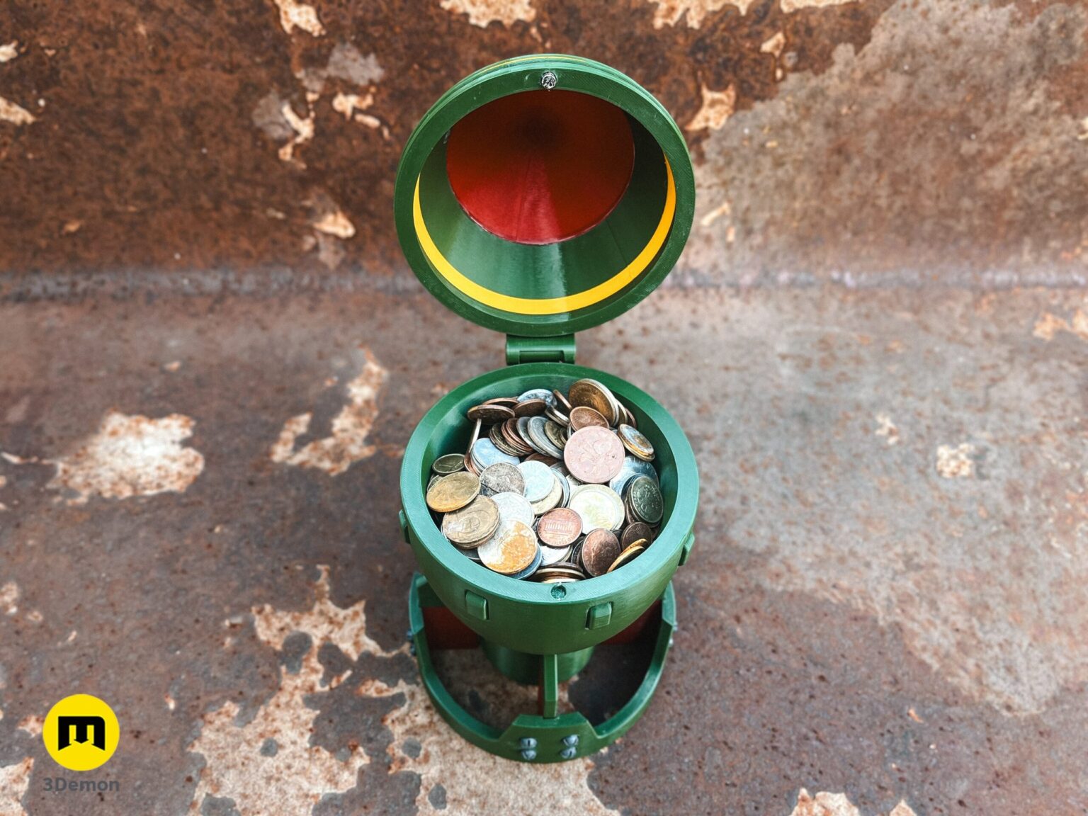 Top-down view of a hand holding an open 3D printed Fallout Mini Nuke bomb container, showing the hollow interior.