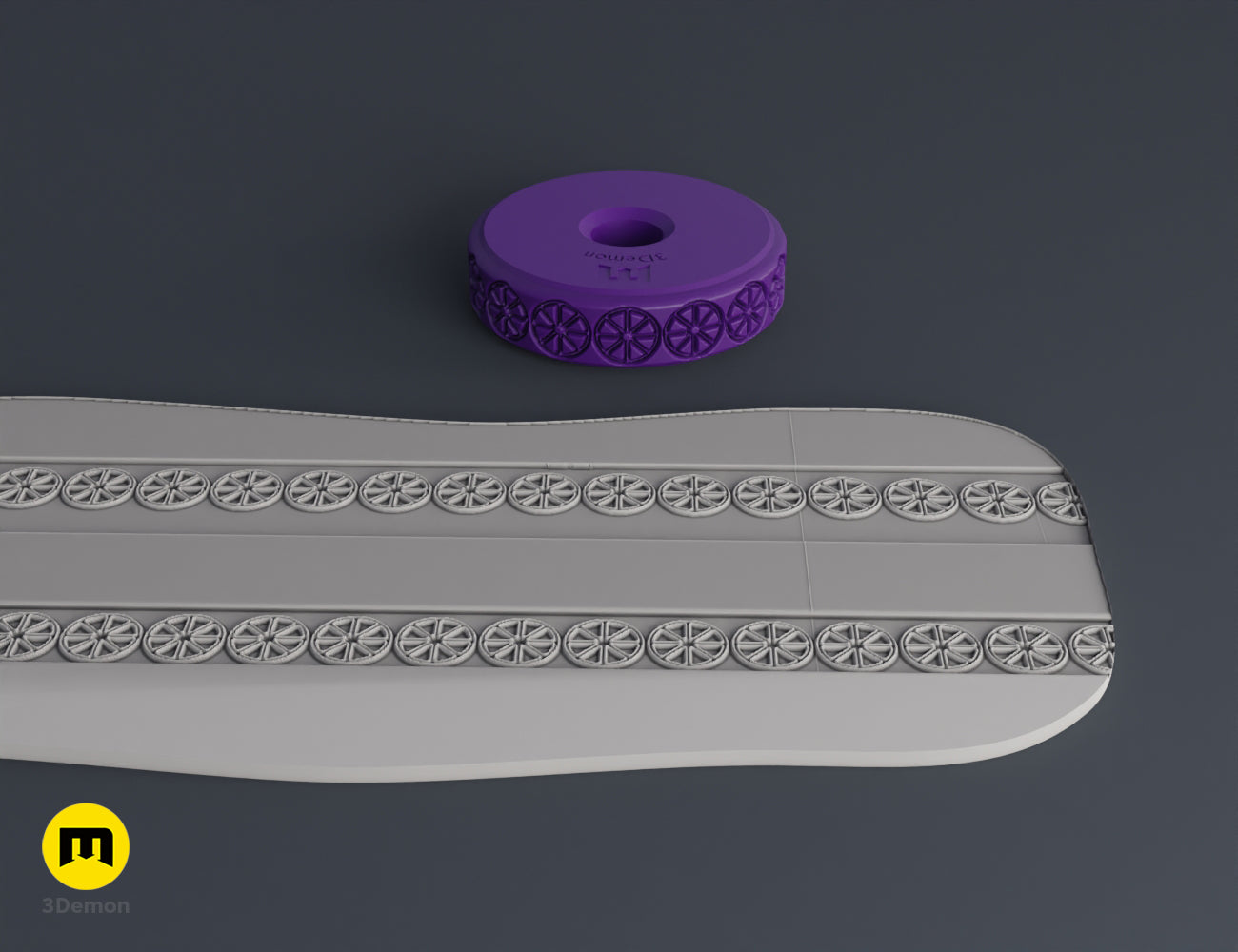 Purple 3D printed stamp wheel with a flower-shaped symbol and its impression on gray clay.