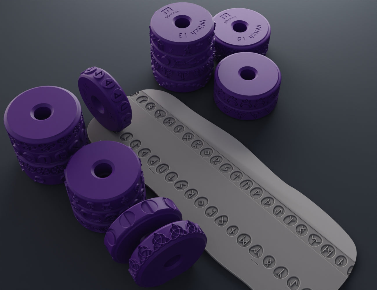 Purple 3D printed stamp wheels with occult symbols rolling on a gray clay strip.
