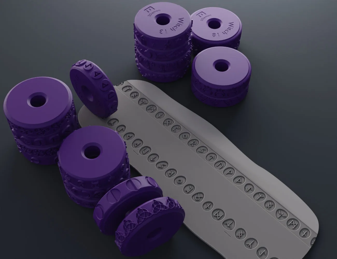 Purple 3D printed stamp wheels with occult symbols rolling on a gray clay strip.