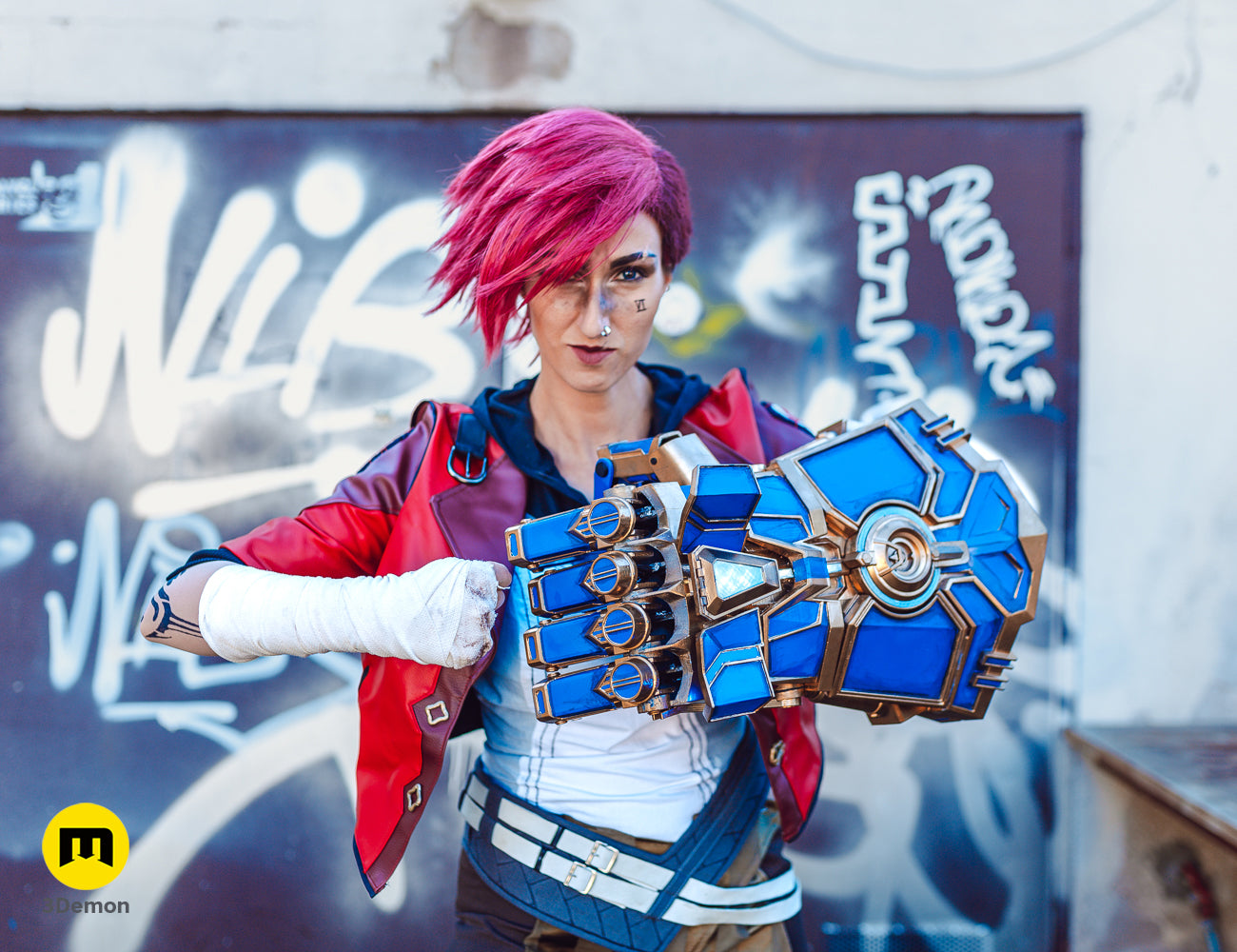 Side view of a 3D printed Arcane Vi mechanical gauntlet prop worn by a cosplayer with pink hair.