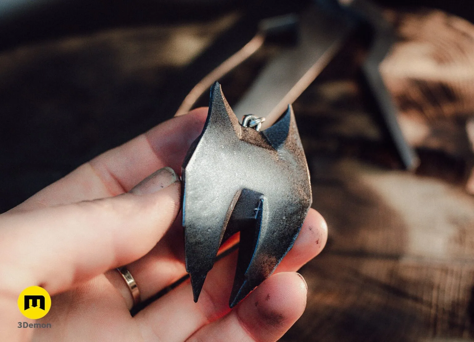 Hand holding the metallic Witcher 4 Lynx medallion showing surface texture – Witcher 4 Lynx Pendant 3D print | 3Demon