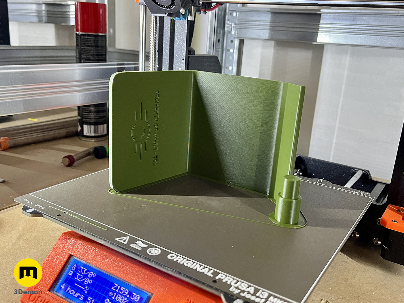 Photo of a 3D printed green Pip Boy part on a Prusa 3D printer bed – Pip Boy Fallout 3D print | 3Demon