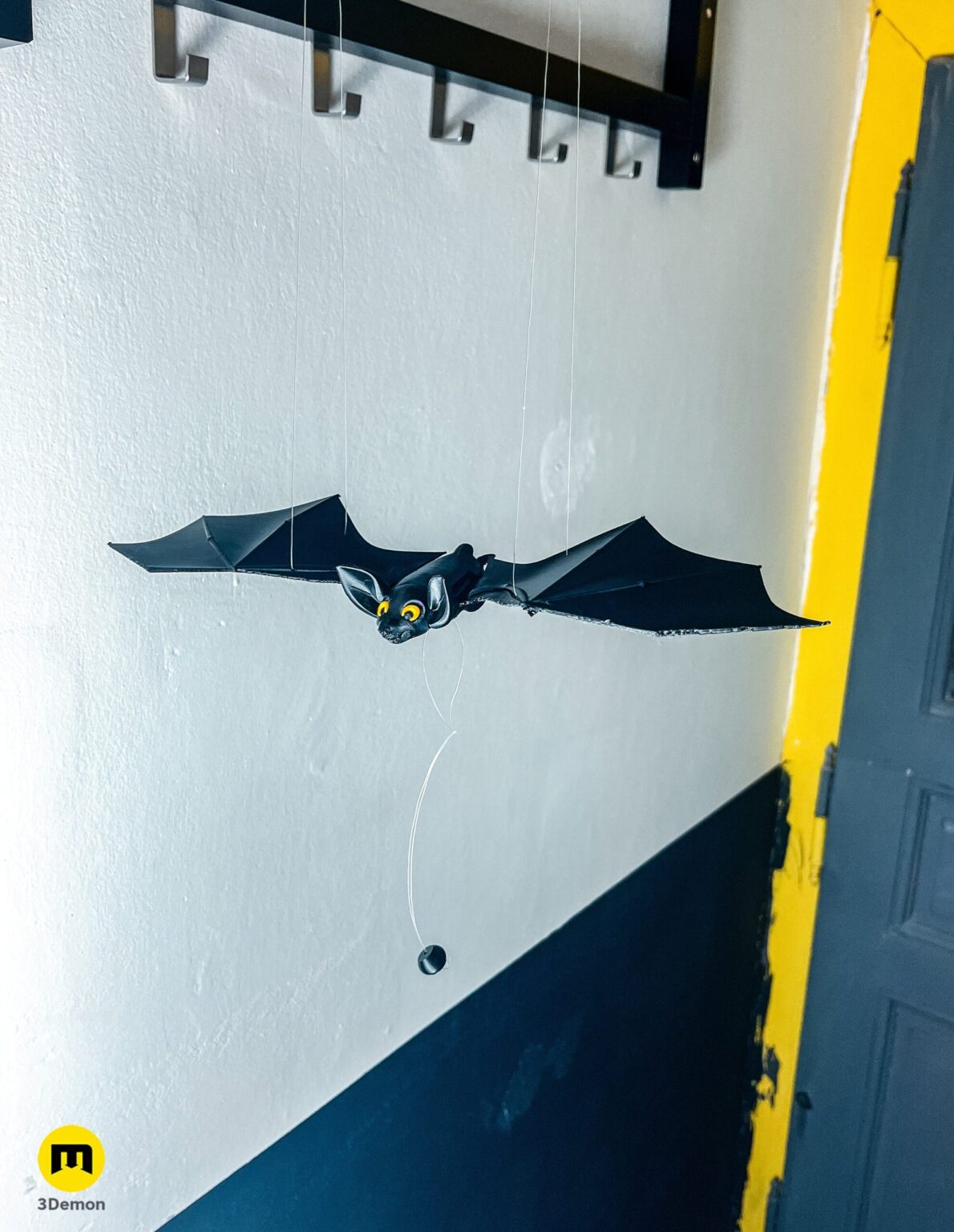 Vertical view of a black 3D printed bat hanging as a Halloween decoration – Halloween Bat Flying Mobile 3D print | 3Demon