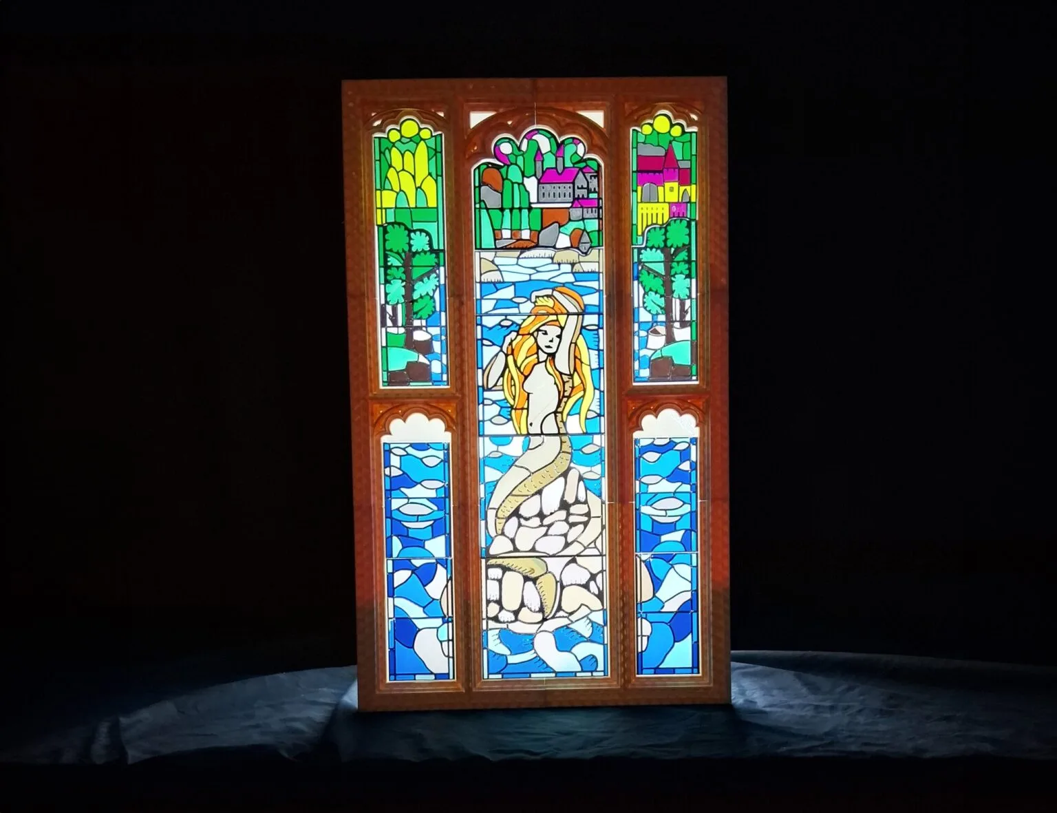 3D printed Harry Potter stained glass bathroom window featuring a mermaid and Hogwarts castle background STL