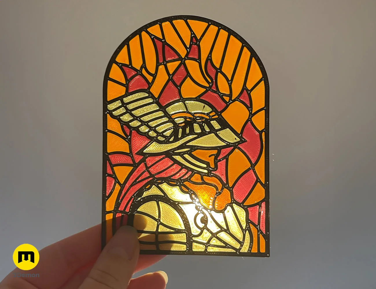 Hand-held arched 3D printed stained glass panel featuring Malenia in orange and gold – Elden Ring Stained Glass 3D print | 3Demon