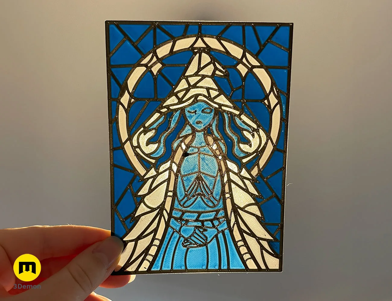 Ranni the Witch 3D printed stained glass panel held against light, featuring blue and white filament – Elden Ring Stained Glass 3D print | 3Demon
