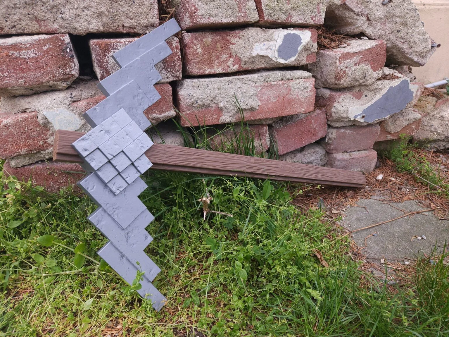 3D printed Diamond Pickaxe from the Minecraft Movie on a display stand cosplay prop