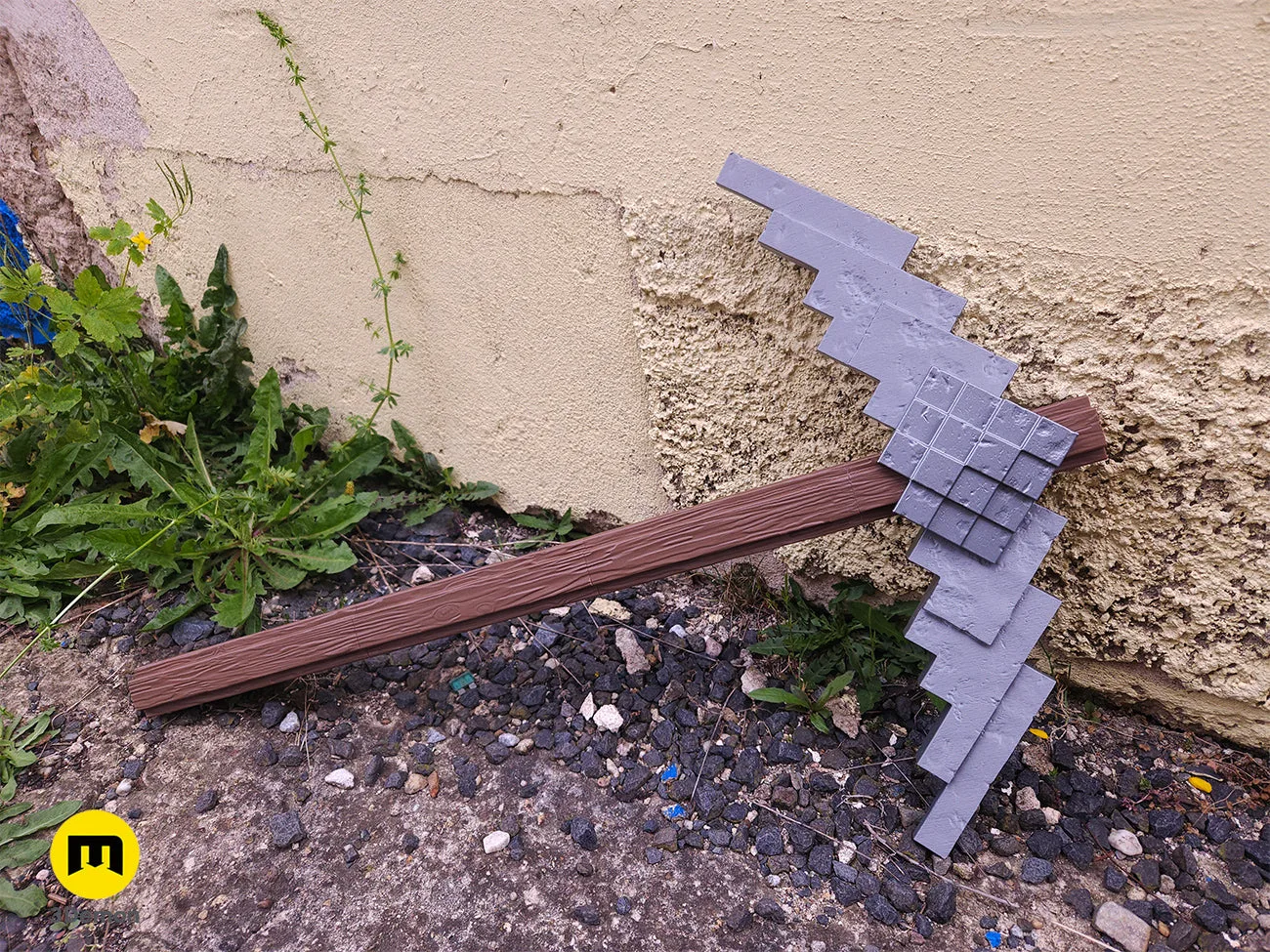 Close-up of 3D printed Minecraft Movie Pickaxe prop showing blocky design and texture
