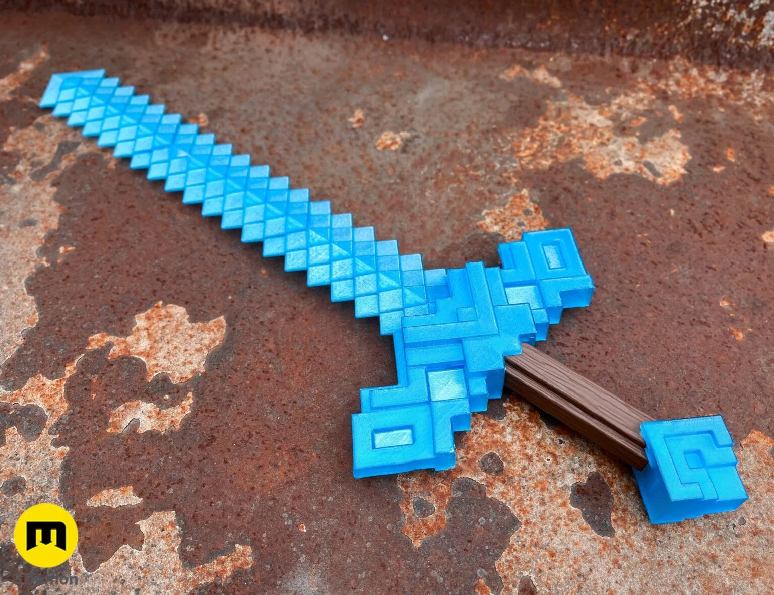Alternate lifestyle photo of 3D printed Minecraft Movie diamond sword (light blue) on rusty surface showing complete pixelated blocky sword profile from diagonal angle
