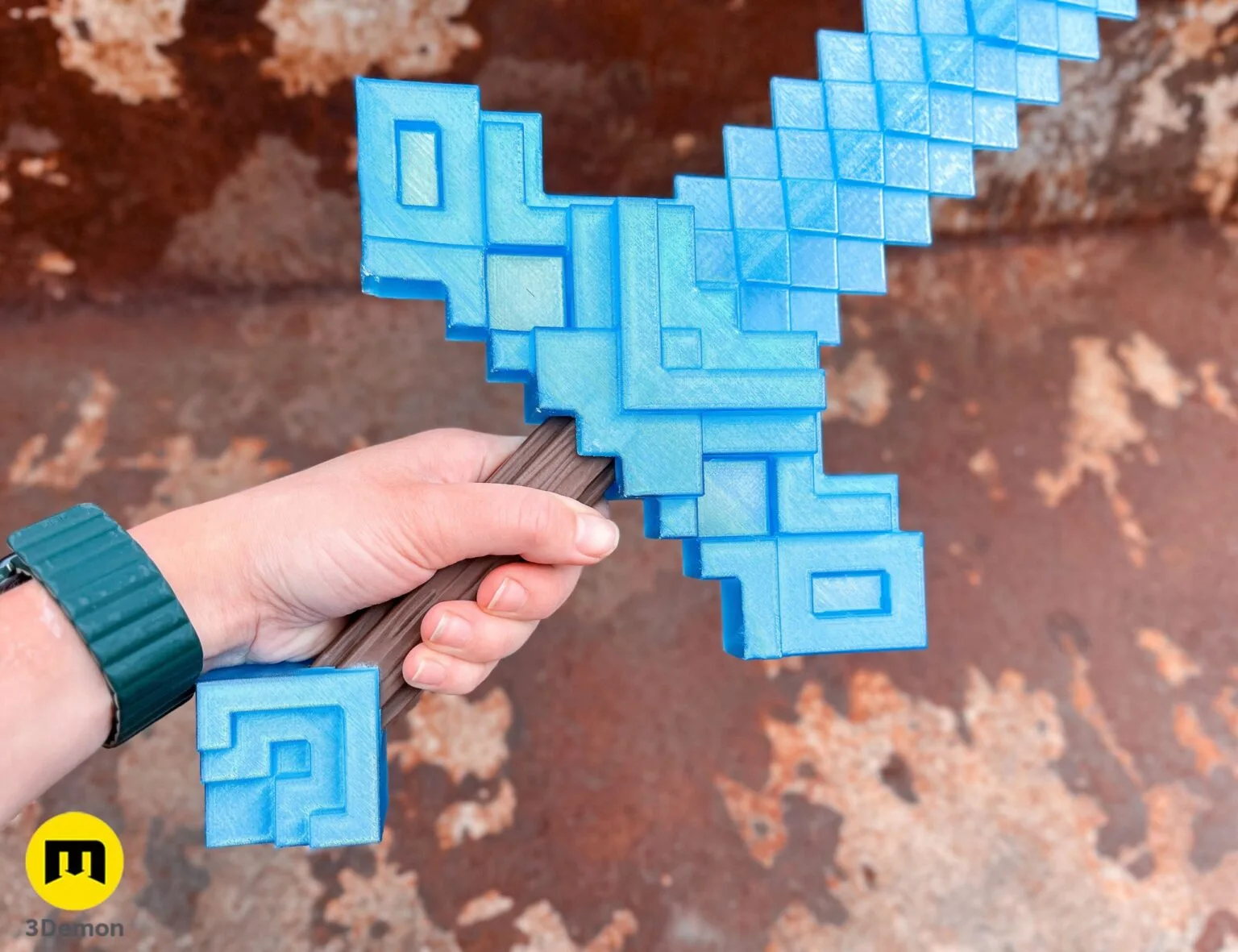 Lifestyle photo of person holding Minecraft Movie diamond sword (light blue translucent) outdoors pointing toward camera showing 700mm scale prop held in cosplay setting