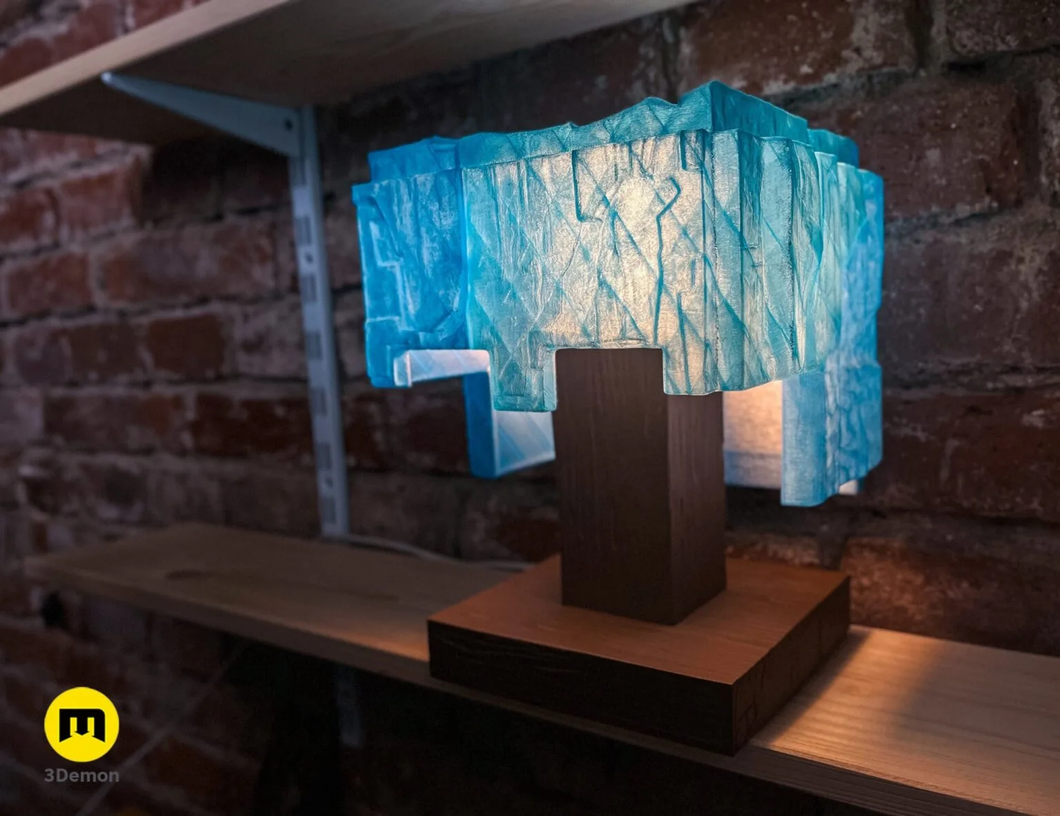 Lifestyle photo in daylight of assembled Minecraft movie diamond helmet lamp not lit on blocky wood-grain stand showing natural light-blue translucent PLA material and cubic faceted surface