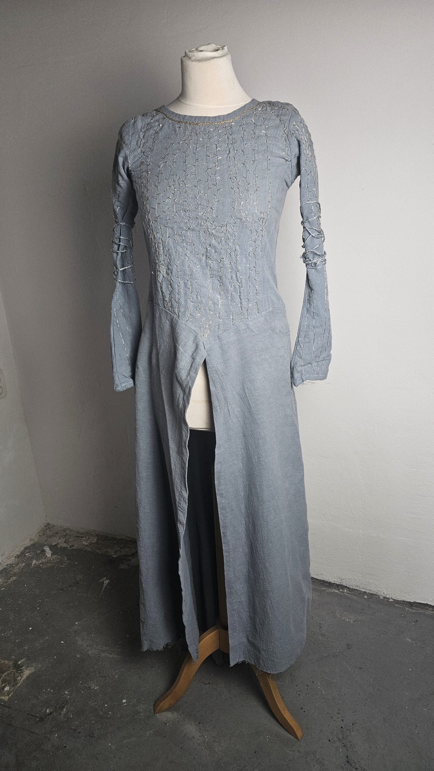 Finished blue underdress on the mannequin, full length
