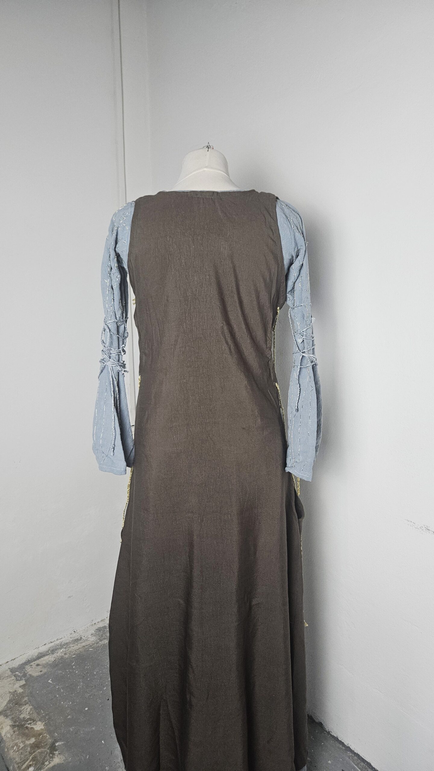 Finished Éowyn refugee dress on the mannequin, full length