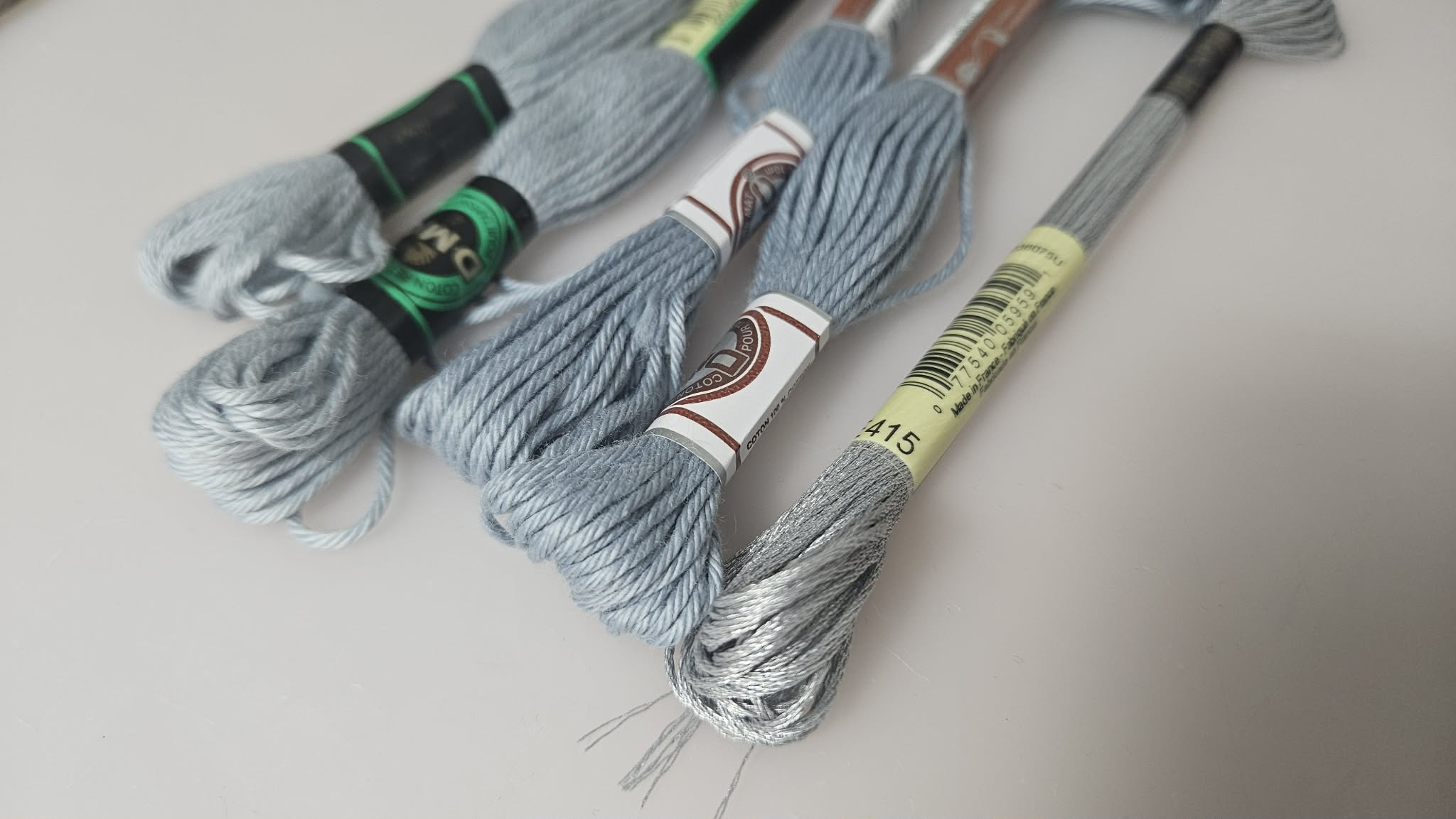 Embroidery floss skeins chosen for braiding the arm cords