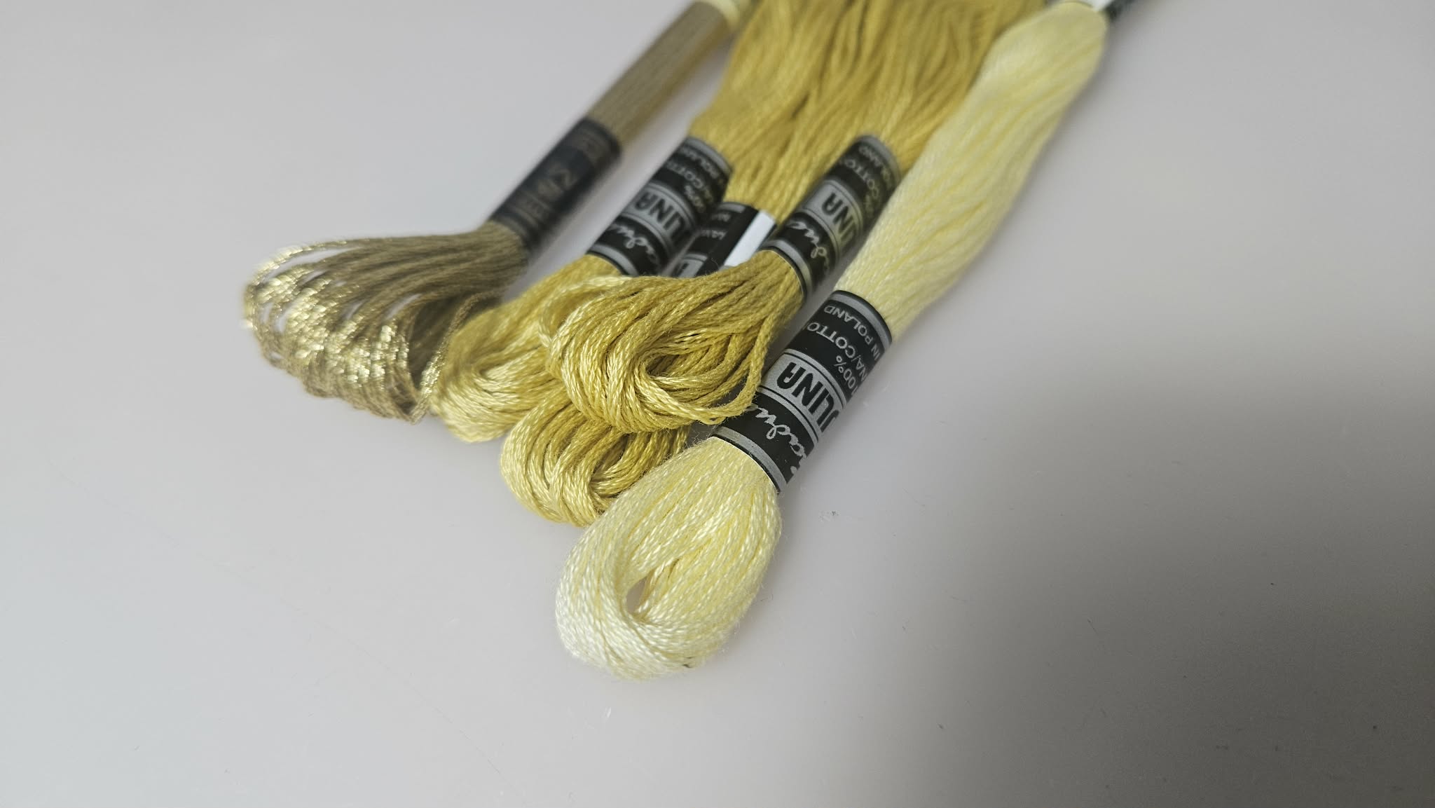 Yellow embroidery floss for the second braided arm cord
