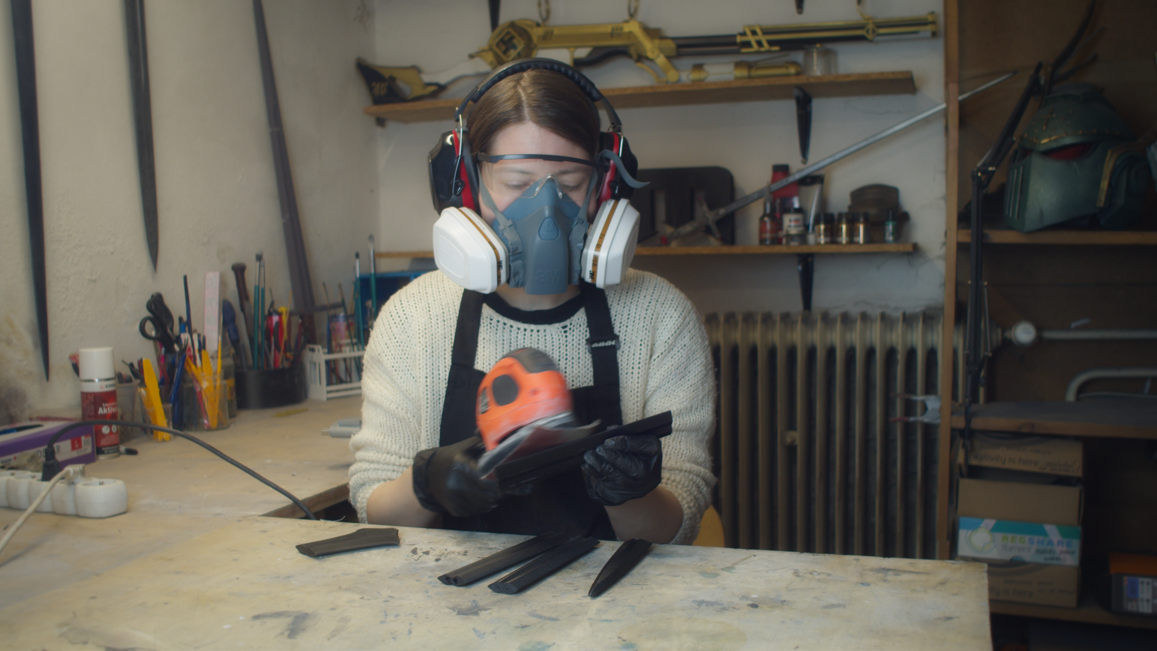 Wearing a respirator mask while sanding the 3D printed sword parts