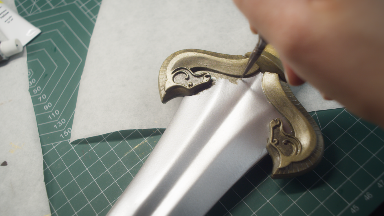 Finishing touches on the painted sword crossguard