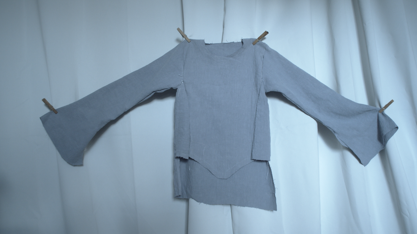 Cut pieces of the blue dress laid out before assembly
