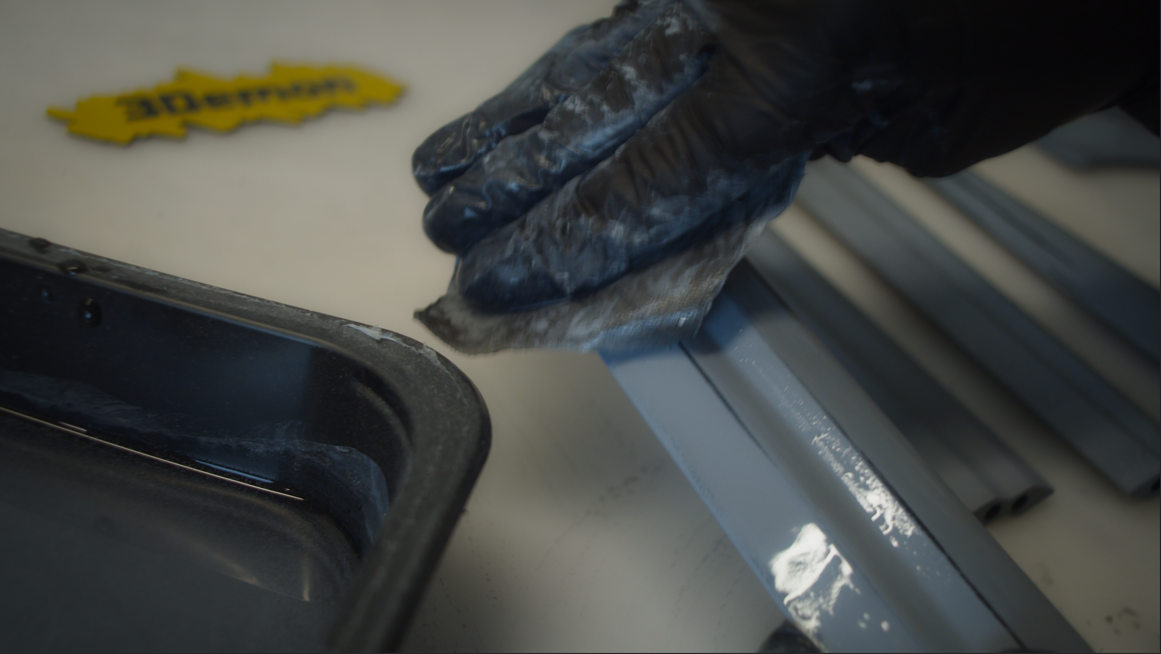 Wet sanding the sword parts with fine grit sandpaper and water