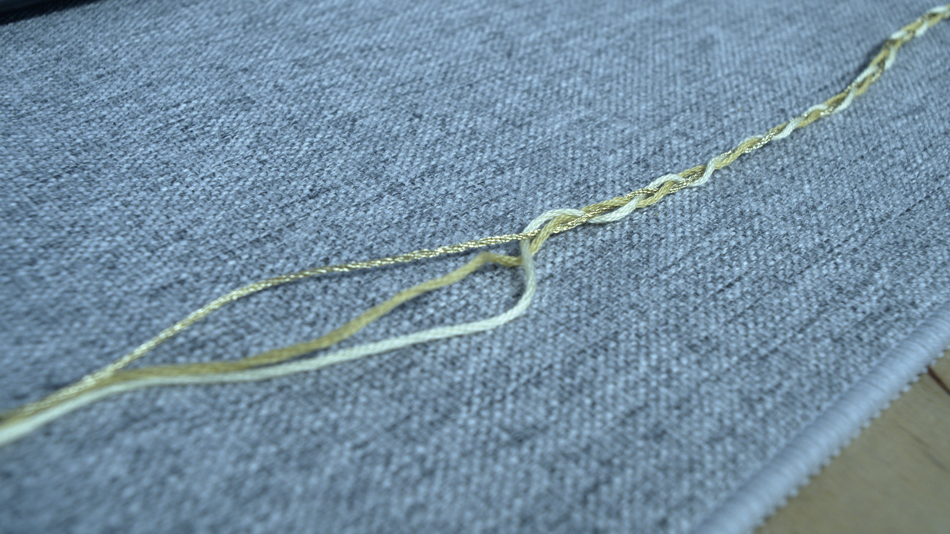 Starting to braid the yellow arm cord