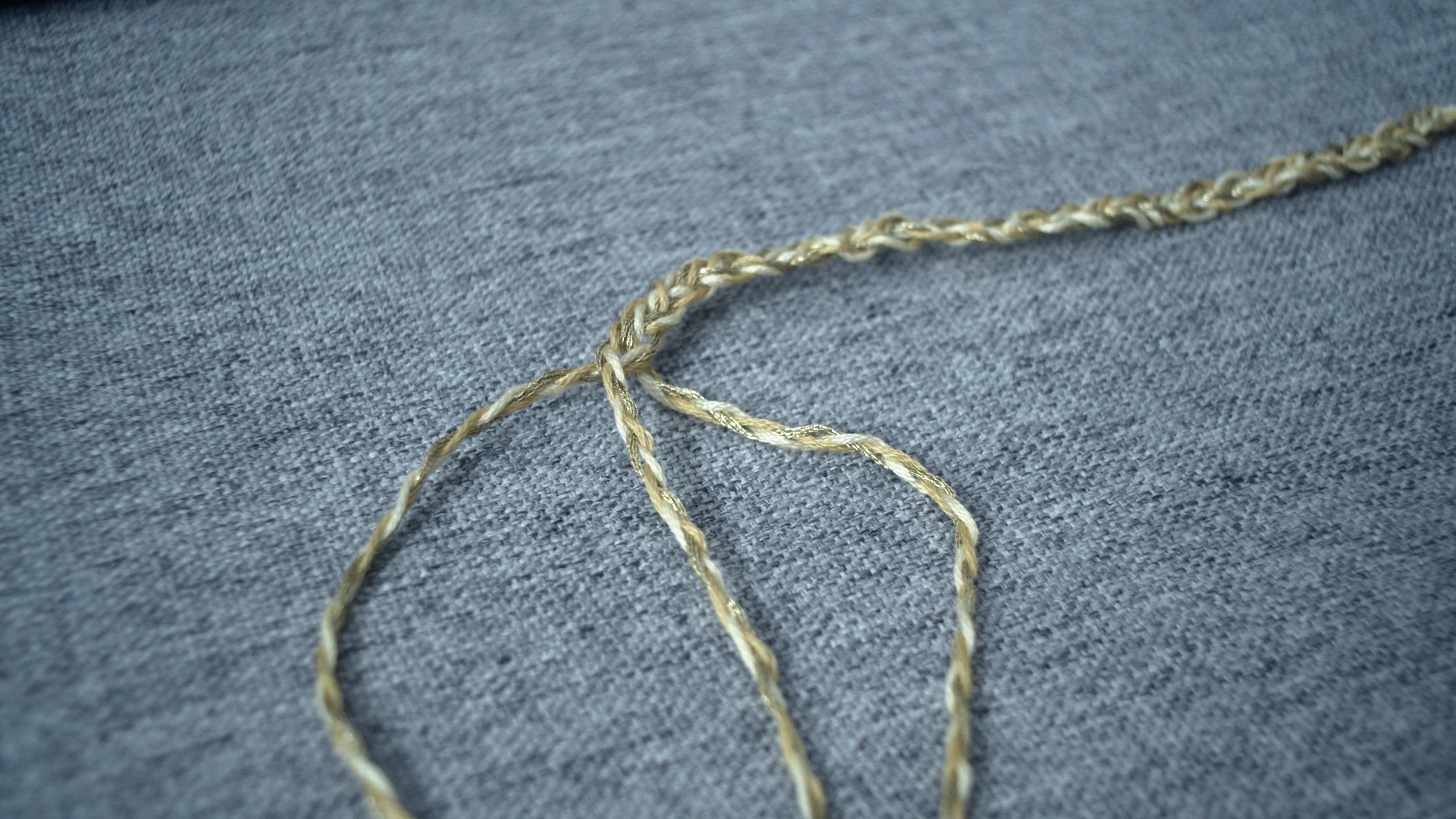 Finished braided yellow arm cord