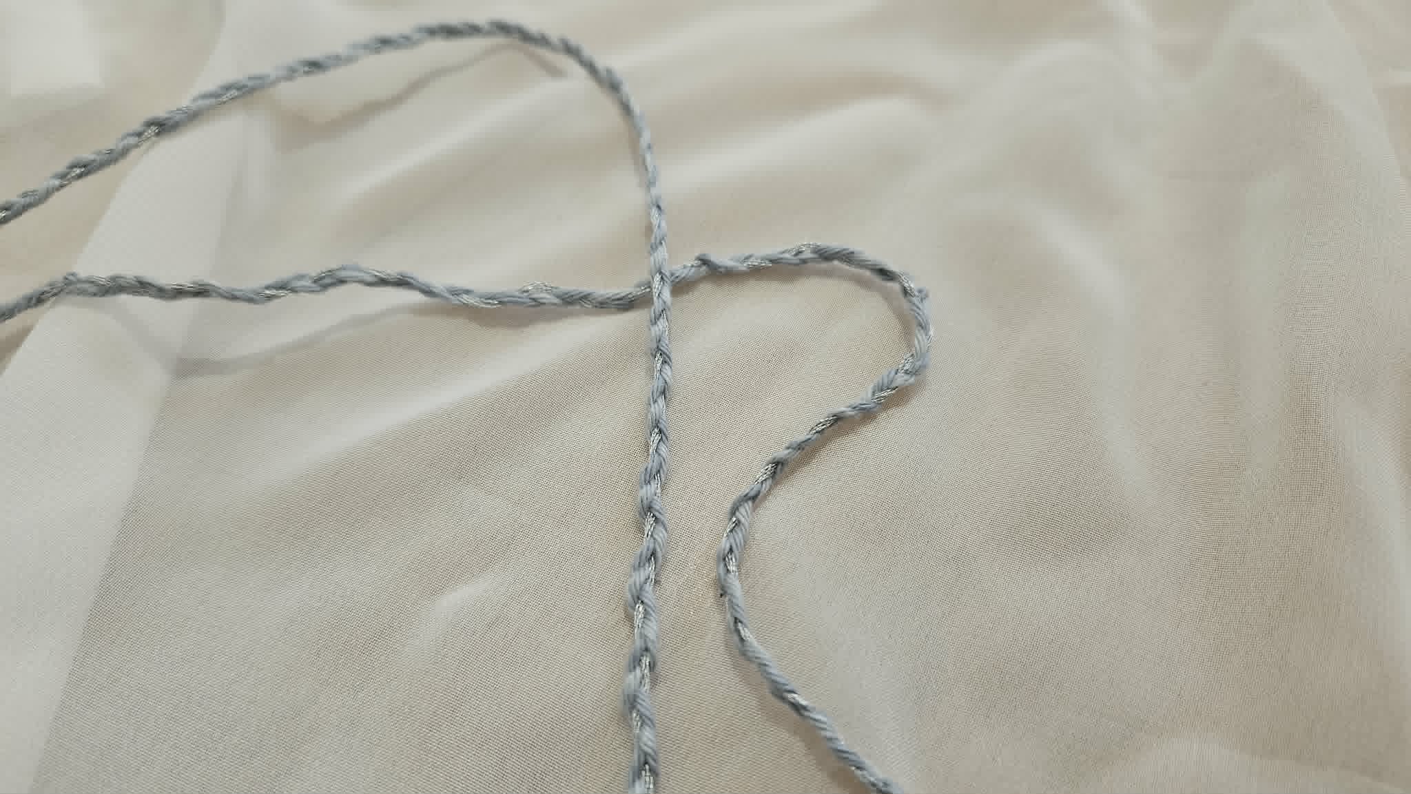 Braided blue cord made from embroidery floss