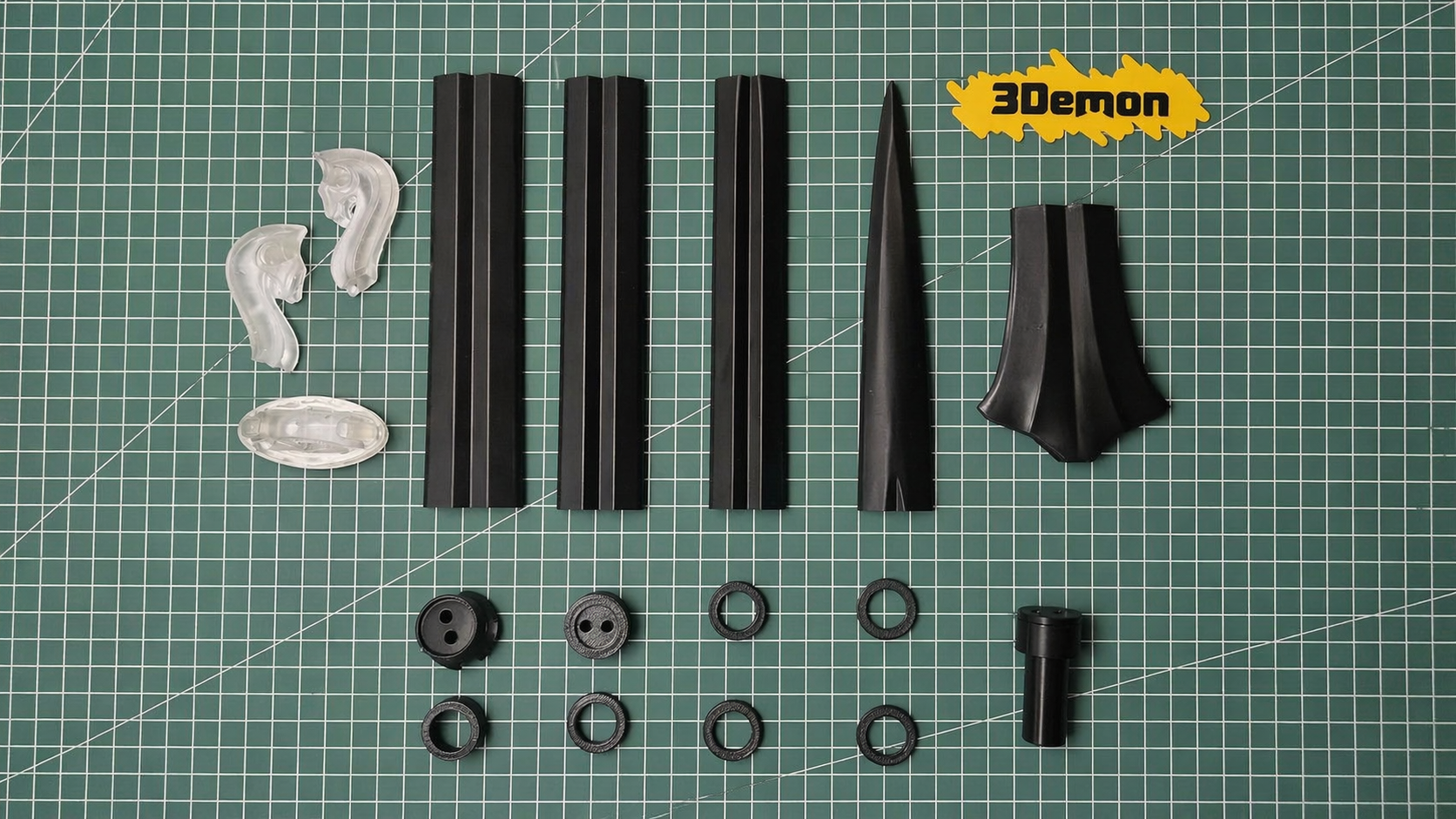 All 3D printed Éowyn sword parts laid out on a cutting mat before assembly